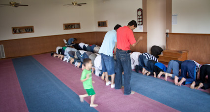 Men pray toward the direction of Kabah in Mecca during 1:30 prayer at the Islamic Society of Greater Kansas City on Tuesday afternoon, June 26, 2012.  RNS photo by Sally Morrow