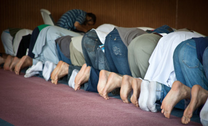 Men pray toward the direction of Kabah in Mecca during 1:30 prayer at the Islamic Society of Greater Kansas City on Tuesday afternoon, June 26, 2012.  RNS photo by Sally Morrow
