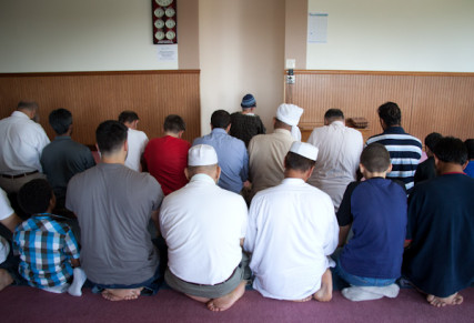 Men pray toward the direction of Kabah in Mecca during 1:30 prayer at the Islamic Society of Greater Kansas City on Tuesday afternoon, June 26, 2012.  RNS photo by Sally Morrow
