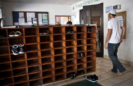 Men and women leave their shoes by the front door during 1:30 prayer at the Islamic Society of Greater Kansas City on Tuesday afternoon, June 26, 2012.  RNS photo by Sally Morrow