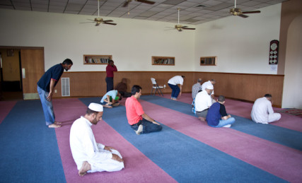 Men pray toward the direction of Kabah in Mecca during 1:30 prayer at the Islamic Society of Greater Kansas City on Tuesday afternoon, June 26, 2012.  RNS photo by Sally Morrow