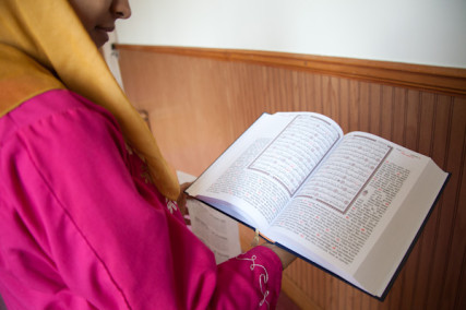 Karam holds a Quran after 1:30 prayer at the Islamic Society of Greater Kansas City on Tuesday afternoon, June 26, 2012.  RNS photo by Sally Morrow