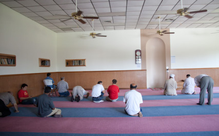 Men pray toward the direction of Kabah in Mecca during 1:30 prayer at the Islamic Society of Greater Kansas City on Tuesday afternoon, June 26, 2012.  RNS photo by Sally Morrow