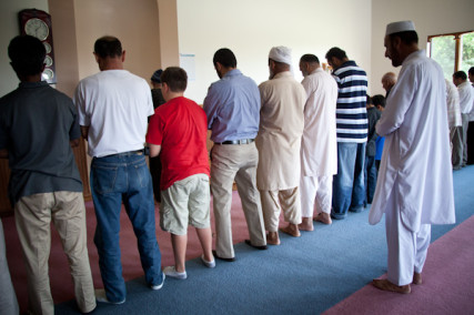 Men pray toward the direction of Kabah in Mecca during 1:30 prayer at the Islamic Society of Greater Kansas City on Tuesday afternoon, June 26, 2012.  RNS photo by Sally Morrow