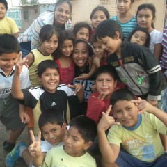 Taelyr Patton, center, is surrounded by children she met during a missions trip to Peru that introduced her to black Southern Baptist missionary mentors. RNS photo courtesy of Taelyr Patton.