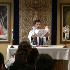 The Rev. Frank Pavone of the anti-abortion group Priests for Life dedicates a basket of naming certificates for 47 babies who died in the Philadelphia clinic of Dr. Kermit Gosnell. RNS photo courtesy Andre Kim/Priests for Life.