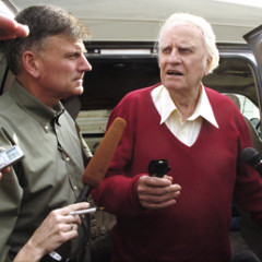 Evangelists Franklin Graham, left, and Billy Graham, right, stop on North Galvez Street in New Orleans’ Lower 9th Ward. Religion News Service photo by Ellis Lucia/The Times-Picayune of New Orleans